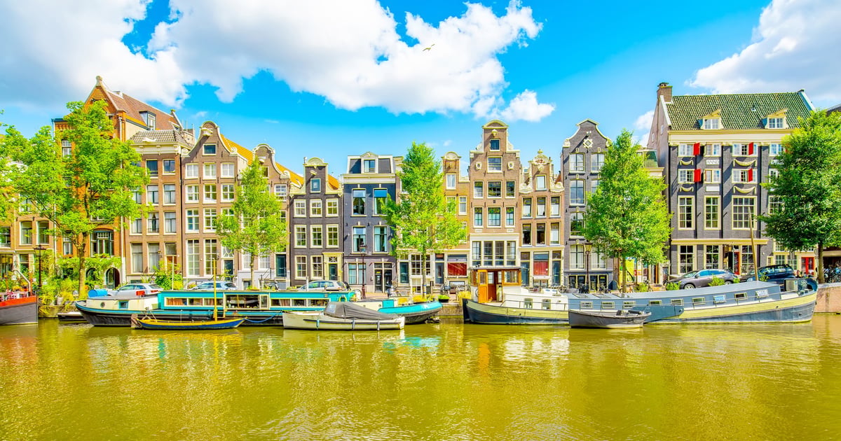 Panoramic view of Amsterdam city, gingerbread houses and central Singel canal, Netherlands travel photo